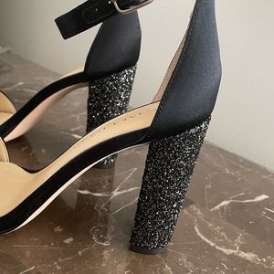 Ivanka Trump Emalyn set an ankle strap sparkle heel sandals.